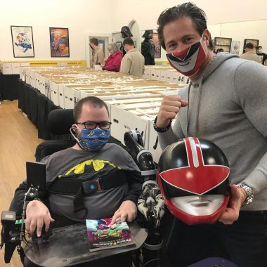 birthday with SMA | SMA News Today | Kevin poses with actor Jason Faunt, who is holding a Power Rangers helmet.
