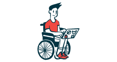 A person in a wheelchair uses a laptop.