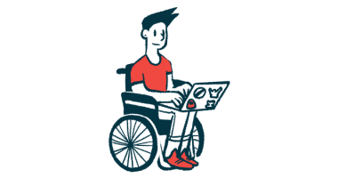 A person in a wheelchair uses a laptop.
