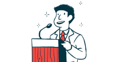 A speaker uses a microphone while standing at a podium.