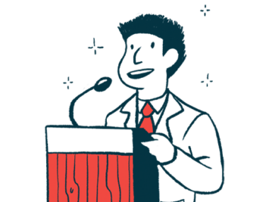 A speaker uses a microphone while standing at a podium.