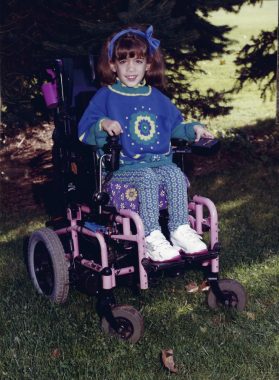 spinal muscular atrophy | SMA News Today | photo fo Alexa Dectis as a young child in a wheelchair