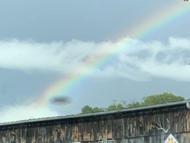 signs from above | SMA News Today | photo of a rainbow just behind a barn