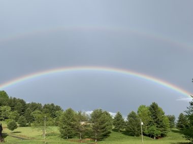 signs from above | SMA News Today | photo of a double rainbow above grass and trees