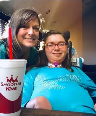 swallowing difficulties | SMA News Today | Halsey and her mom smile for a photo next to a large styrofoam cup from Smoothie King