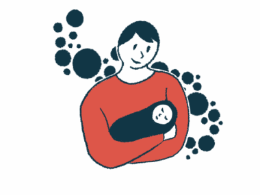 A person holds an infant wrapped in a blanket.