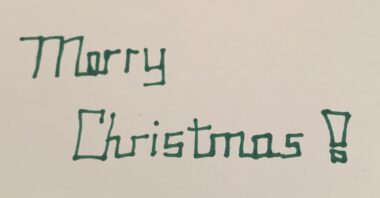 The words "Merry Christmas" in blocky cursive