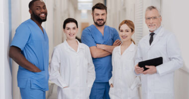 A team of healthcare specialists standing in a hospital