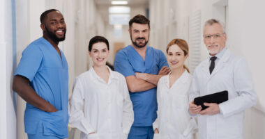 A team of healthcare specialists standing in a hospital