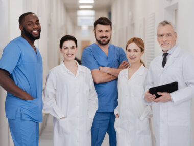 A team of healthcare specialists standing in a hospital