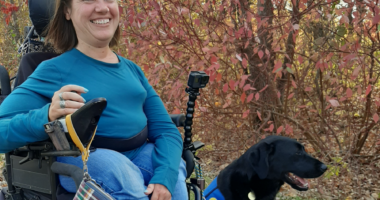 DeAnn Runge in her wheelchair with her dog