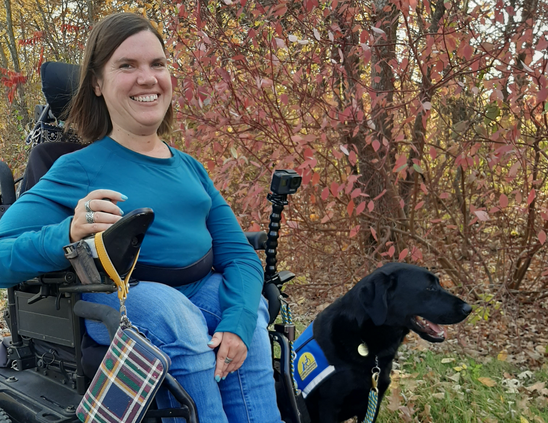 DeAnn Runge in her wheelchair with her dog