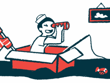 A child wearing a sailor hat sits in a box and holds a toy fishing pole.