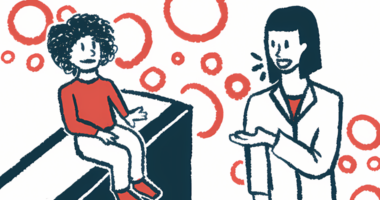 A therapist talks with a child seated on a bench.